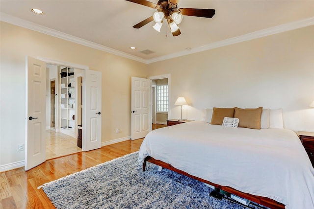 1529 Rosewood St, Houston, TX 77004 - bedroom with crown molding, light wood-style flooring, baseboards, recessed lighting, and a ceiling fan