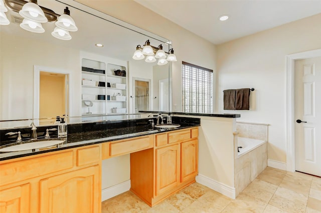 1529 Rosewood St, Houston, TX 77004 - bathroom featuring double vanity, a bath, and recessed lighting