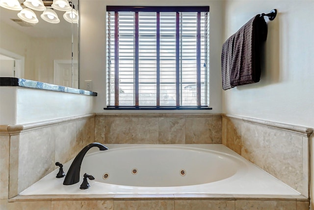 1529 Rosewood St, Houston, TX 77004 - full bath featuring a jetted tub and a chandelier