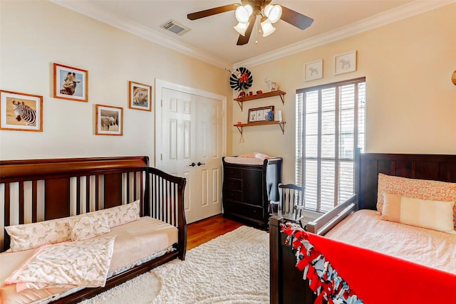 1529 Rosewood St, Houston, TX 77004 - bedroom featuring ornamental molding, wood finished floors, a closet, and a ceiling fan