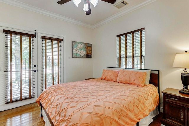 1529 Rosewood St, Houston, TX 77004 - bedroom with access to outside, ornamental molding, light wood finished floors, and a ceiling fan
