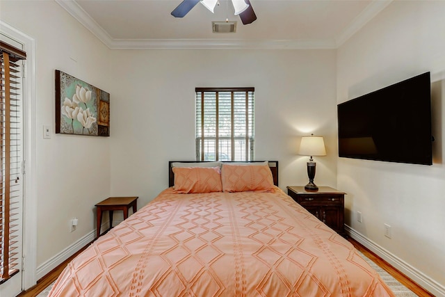 1529 Rosewood St, Houston, TX 77004 - bedroom featuring crown molding, wood finished floors, a ceiling fan, and baseboards