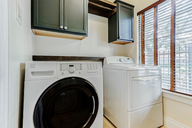 1529 Rosewood St, Houston, TX 77004 - laundry room featuring cabinet space and washing machine and clothes dryer