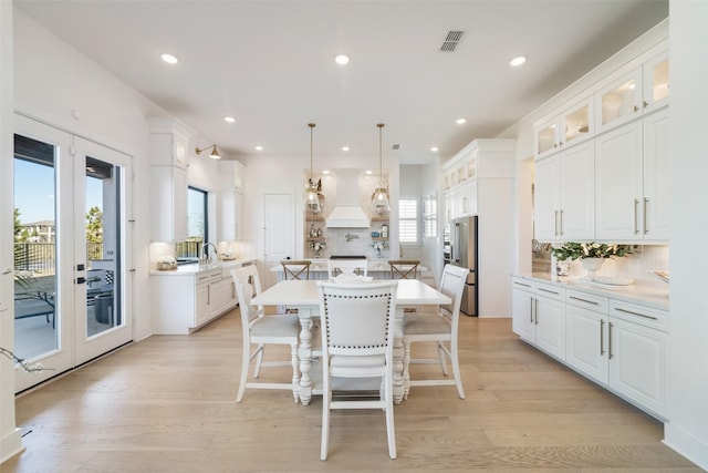 11303 Flying Admiral Dr, Cypress, TX 77433 - kitchen with backsplash, a center island, white cabinetry, and recessed lighting