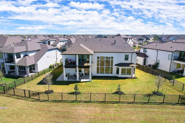 11303 Flying Admiral Dr, Cypress, TX 77433 - rear view of house with a residential view, stucco siding, roof with shingles, and a patio