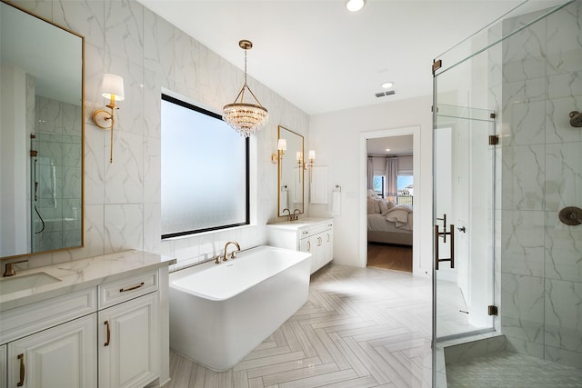 11303 Flying Admiral Dr, Cypress, TX 77433 - bathroom featuring connected bathroom, a marble finish shower, vanity, a soaking tub, and recessed lighting