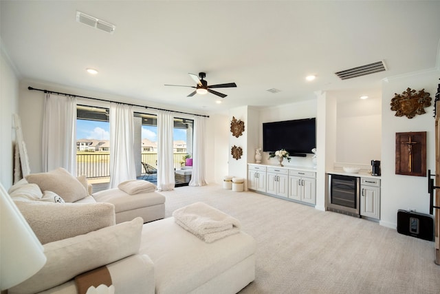 11303 Flying Admiral Dr, Cypress, TX 77433 - carpeted living room featuring wine cooler, ornamental molding, ceiling fan, and recessed lighting