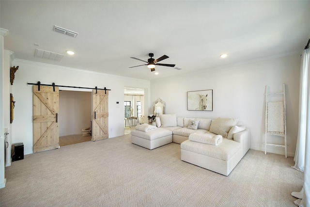 11303 Flying Admiral Dr, Cypress, TX 77433 - living area with a barn door, a ceiling fan, crown molding, light carpet, and recessed lighting