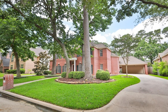6914 Kelsey Rae Ct, Houston, TX 77069 - view of front of property with brick siding, a front yard, and concrete driveway