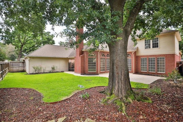 6914 Kelsey Rae Ct, Houston, TX 77069 - rear view of house with brick siding, a patio, and a chimney