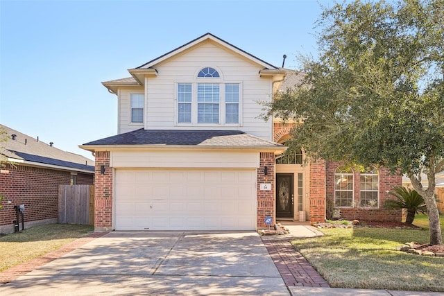 14 Carmel Chase Ct, Manvel, TX 77578 - traditional-style house with driveway, an attached garage, brick siding, and roof with shingles