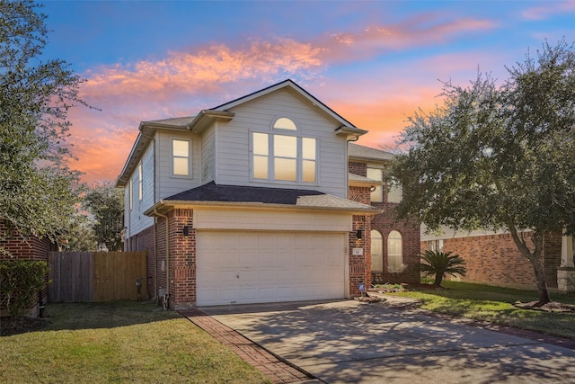 14 Carmel Chase Ct, Manvel, TX 77578 - traditional-style house with concrete driveway, a garage, and brick siding