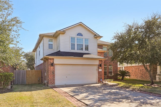 14 Carmel Chase Ct, Manvel, TX 77578 - traditional-style home featuring driveway, an attached garage, and brick siding
