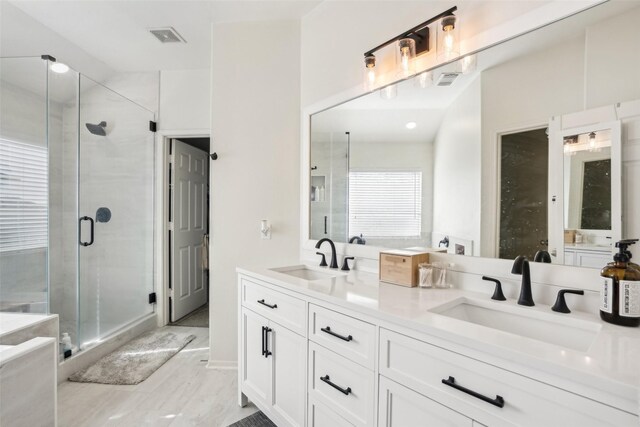 14 Carmel Chase Ct, Manvel, TX 77578 - bathroom featuring double vanity and a shower stall