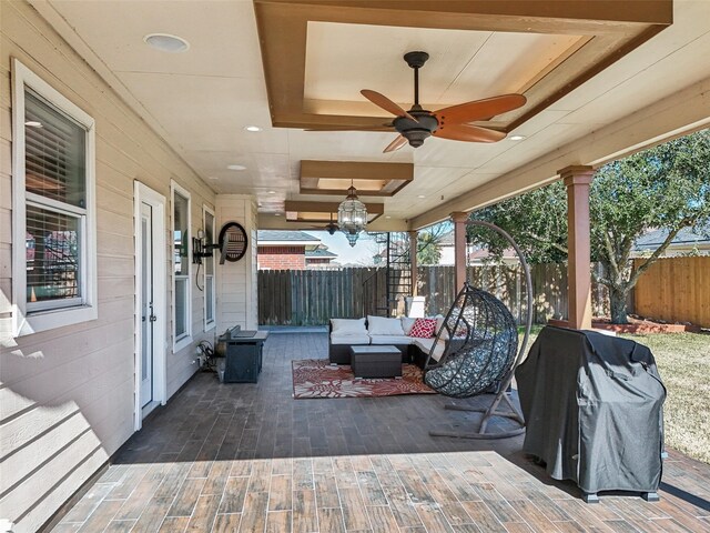 14 Carmel Chase Ct, Manvel, TX 77578 - fenced backyard featuring an outdoor living space and a ceiling fan