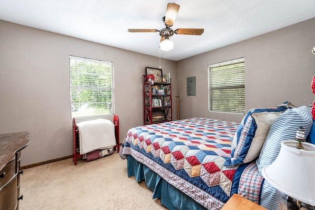 134 Private Road 652, Sargent, TX 77414 - bedroom with light carpet, ceiling fan, and baseboards