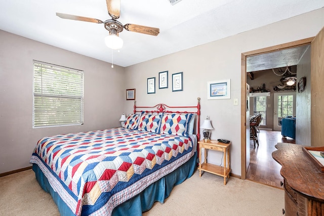 134 Private Road 652, Sargent, TX 77414 - bedroom featuring light carpet, baseboards, and a ceiling fan