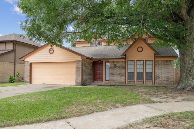 12115 Essenbruk Dr, Houston, TX 77066 - view of front of house with a garage, brick siding, driveway, roof with shingles, and a front lawn