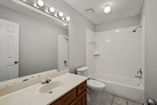 12115 Essenbruk Dr, Houston, TX 77066 - bathroom with vanity, toilet, shower / washtub combination, a textured ceiling, and tile patterned flooring