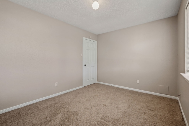 12115 Essenbruk Dr, Houston, TX 77066 - carpeted spare room with baseboards and a textured ceiling