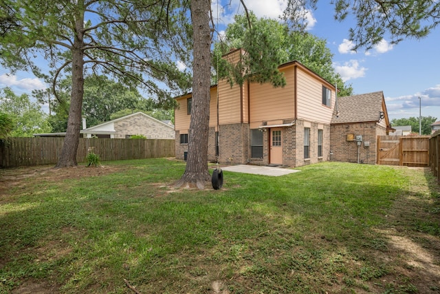 12115 Essenbruk Dr, Houston, TX 77066 - rear view of property featuring brick siding and a patio