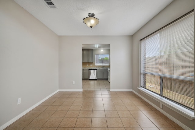 12115 Essenbruk Dr, Houston, TX 77066 - unfurnished dining area featuring light tile patterned flooring and baseboards