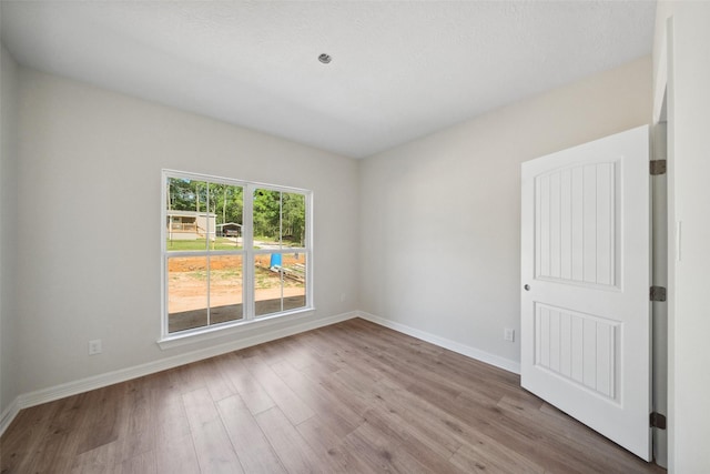 190 Faulkner Ave, Coldspring, TX 77331 - empty room with wood finished floors and baseboards
