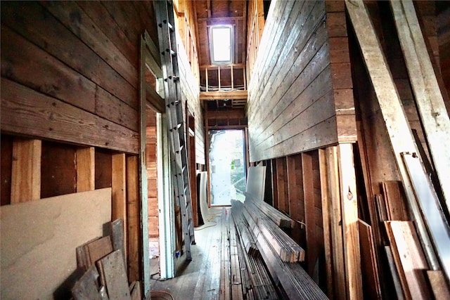 2215 Kane St, Houston, TX 77007 - misc room with wood walls and healthy amount of natural light