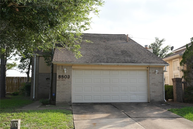 8803 Vinkins Rd, Houston, TX 77071 - view of front of property featuring brick siding, roof with shingles, and driveway
