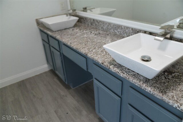 8803 Vinkins Rd, Houston, TX 77071 - full bath featuring double vanity and wood finished floors