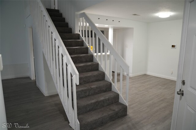 8803 Vinkins Rd, Houston, TX 77071 - stairway with wood finished floors and baseboards