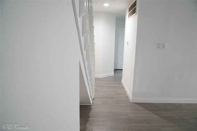 8803 Vinkins Rd, Houston, TX 77071 - hall featuring baseboards, wood finished floors, and recessed lighting