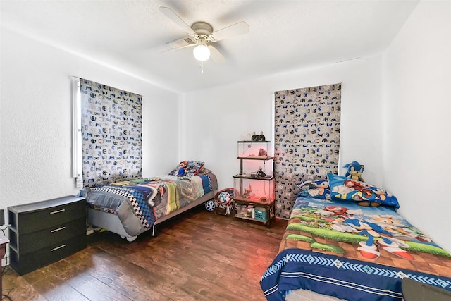 1607 Beusch Dr, Pasadena, TX 77502 - bedroom with wood finished floors and a ceiling fan