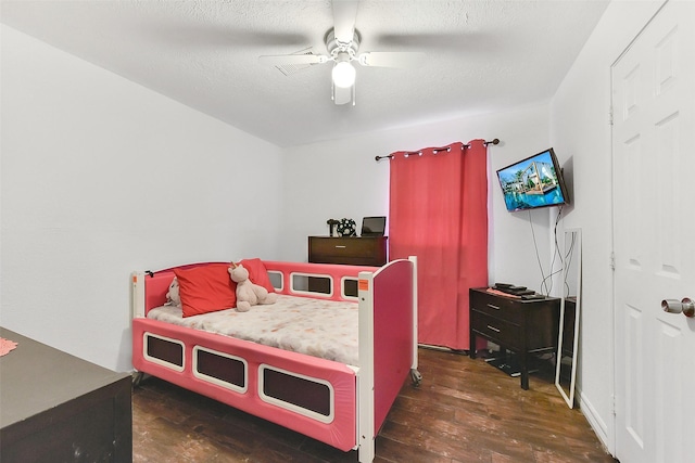 1607 Beusch Dr, Pasadena, TX 77502 - bedroom featuring dark wood-style flooring and ceiling fan