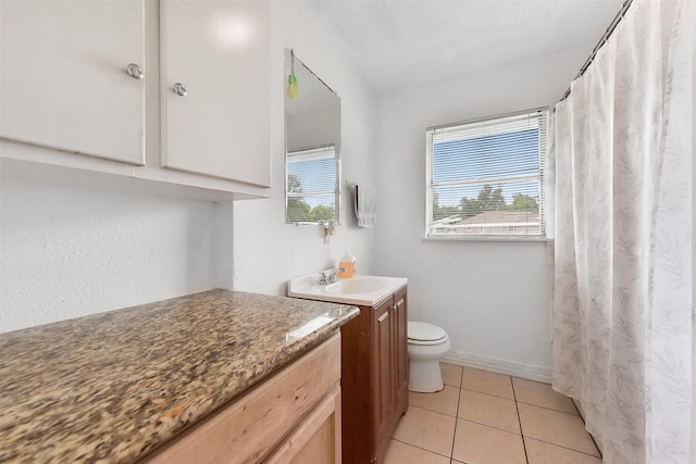 1607 Beusch Dr, Pasadena, TX 77502 - bathroom featuring vanity, toilet, tile patterned floors, baseboards, and curtained shower