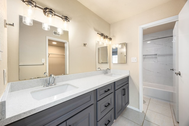 7575 Cambridge St Unit 1604, Houston, TX 77054 - bathroom featuring double vanity, tile patterned floors, bathing tub / shower combination, and baseboards