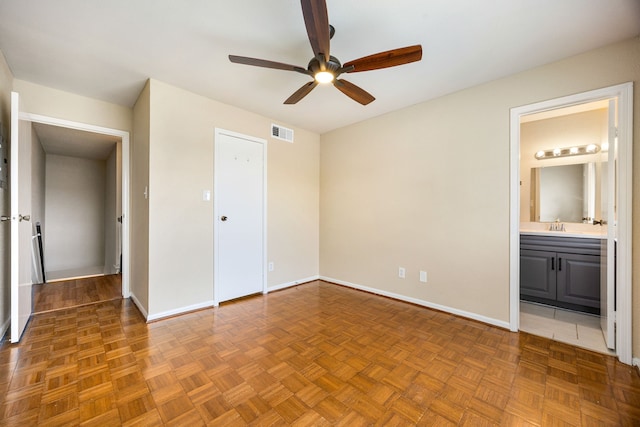 7575 Cambridge St Unit 1604, Houston, TX 77054 - unfurnished bedroom with baseboards, ensuite bath, and ceiling fan