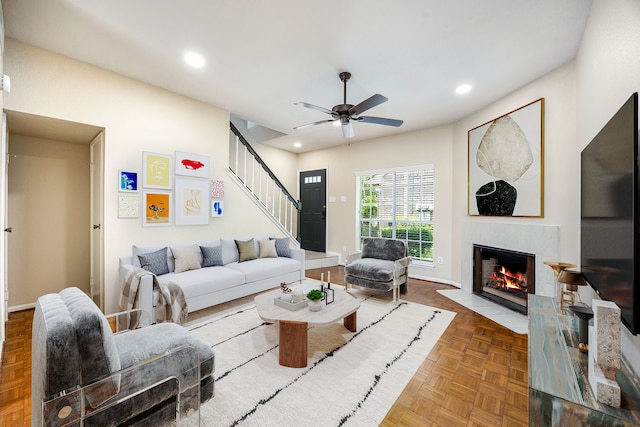 7575 Cambridge St Unit 1604, Houston, TX 77054 - living room with stairway, a fireplace with flush hearth, recessed lighting, a ceiling fan, and baseboards