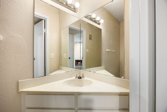 7575 Cambridge St Unit 1604, Houston, TX 77054 - bathroom featuring a textured wall and vanity