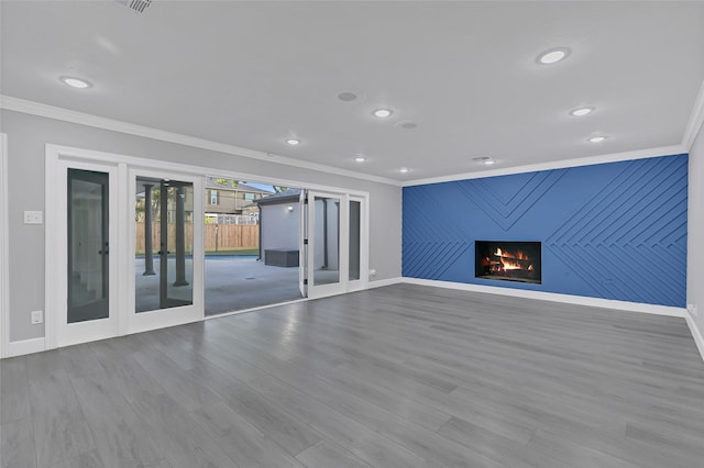 5122 Braesheather Dr, Houston, TX 77096 - unfurnished living room featuring french doors, ornamental molding, baseboards, wood finished floors, and recessed lighting