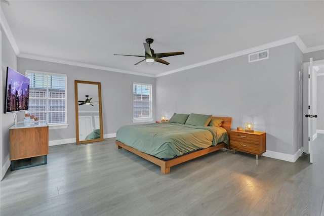 5122 Braesheather Dr, Houston, TX 77096 - bedroom featuring wood finished floors, baseboards, crown molding, and ceiling fan