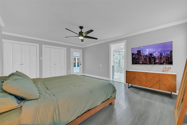 5122 Braesheather Dr, Houston, TX 77096 - bedroom featuring wood finished floors, ornamental molding, multiple closets, ensuite bathroom, and ceiling fan