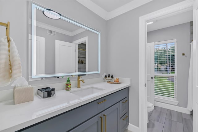 5122 Braesheather Dr, Houston, TX 77096 - bathroom with vanity, toilet, ornamental molding, and baseboards