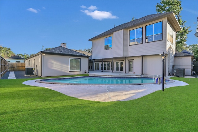 5122 Braesheather Dr, Houston, TX 77096 - back of house featuring central air condition unit and a patio