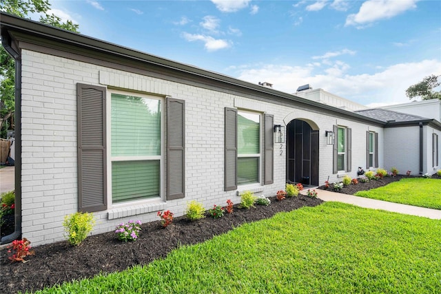 5122 Braesheather Dr, Houston, TX 77096 - view of front facade featuring brick siding and a front lawn