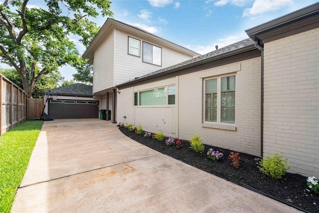 5122 Braesheather Dr, Houston, TX 77096 - view of side of property featuring brick siding and a shingled roof