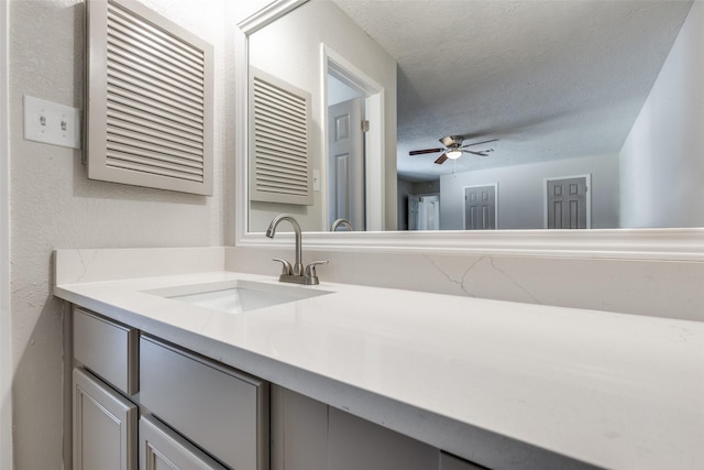 23314 Bright Star Dr, Spring, TX 77373 - bathroom featuring vanity, a textured ceiling, and a ceiling fan