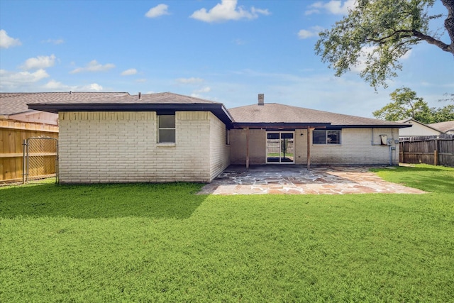 23314 Bright Star Dr, Spring, TX 77373 - back of house featuring brick siding, a patio area, and roof with shingles