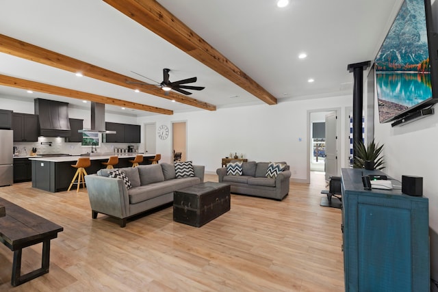 17131 Carrol Ln, Willis, TX 77378 - living room with recessed lighting, a ceiling fan, light wood-style floors, beamed ceiling, and baseboards