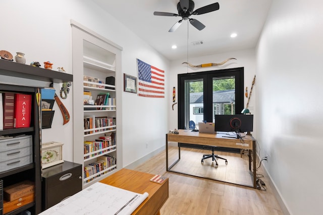 17131 Carrol Ln, Willis, TX 77378 - office featuring wood finished floors, baseboards, ceiling fan, and built in shelves